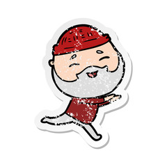 distressed sticker of a cartoon happy bearded man