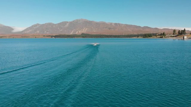 Jet Ski on Beautiful Turquoise Blue Water - Lake Tekapo, New Zealand - Aerial