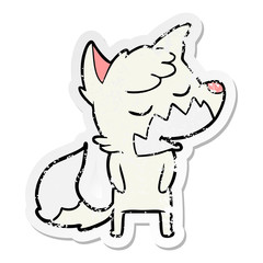 distressed sticker of a friendly cartoon fox