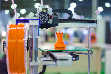 Three dimensional printer during work at 3d science technology exhibition. 3D printing, additive...