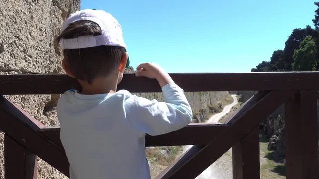 Rhodes, Greece - 21st of April 2018: 4K Touring old town of Rhodes - Traveling child and the fortress with road around