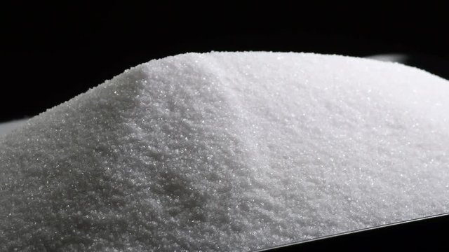 Mountain of white sugar refined gyrating