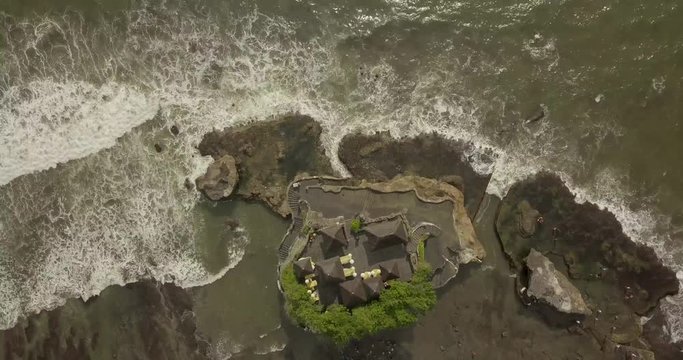 Breathtaking aerial view of Pura Tanah Lot. Tanah Lot is a rock formation off the Indonesian island of Bali.