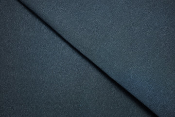 Dark blue textile sample. Fabric texture background concept.
