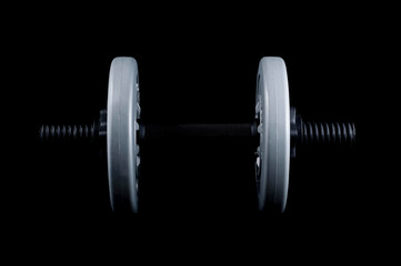 Preparing for the summer beach season with dumbbells