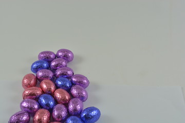 colourful chocolate Easter eggs on a white background