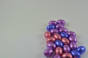 colourful chocolate Easter eggs on a white background