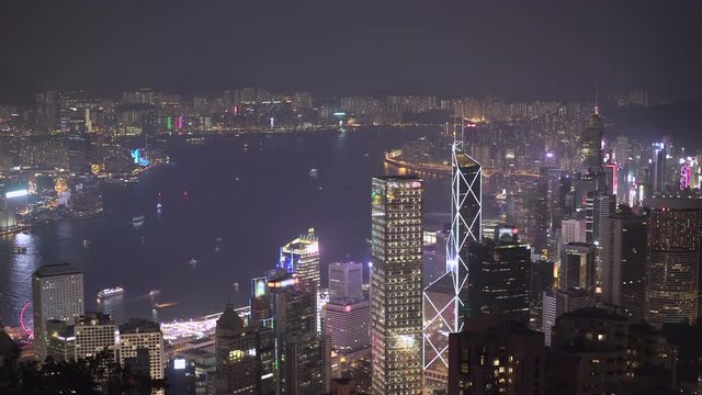 Hong Kong cityscape with Victoria Harbour at night. View from Victoria peak - October 2018: Hong Kong, China