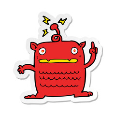sticker of a cartoon weird little alien