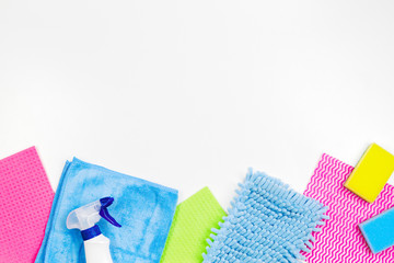 Housework, housekeeping, household, cleaning service concept. Bottle of detergent, rags and sponges on white background