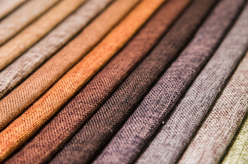 A set of samples of fabric furniture decoration lines of textile textures. Multicolored stripes upholstery. Mode and tone for a luxurious interior style. Abstract background