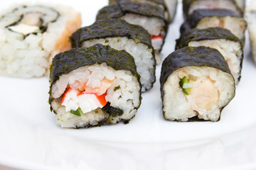 Japanese cuisine, rice sushi and fish - closeup
