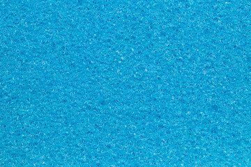 Sponge texture background. Close-up of blue bath sponge texture with porous structure for...