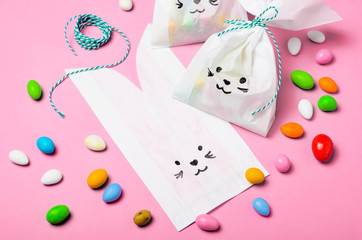 Obraz na płótnie Canvas Bunny Bags with Chocolate Eggs, Easter Sweet Treats
