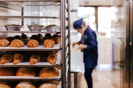 unrecognizable woman on bakery. selective focus with croissants and bread