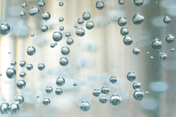 A bubbles on a transparent glass with a mineral water.