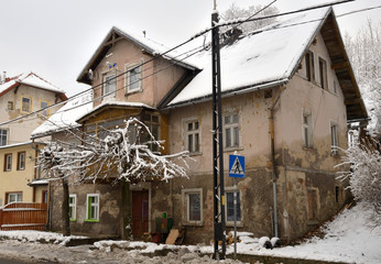 Fototapeta na wymiar Listopad street in winter, Swieradow Zdroj resort, northern slope of Jizera Mountains, Poland