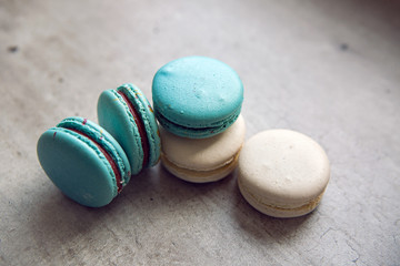 blue and white cakes maccarone lie on a gray