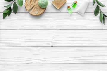 organic spa with herbal cosmetics on white wooden background top view mockup