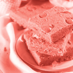 Blondies with candies for breakfast. Coral toned