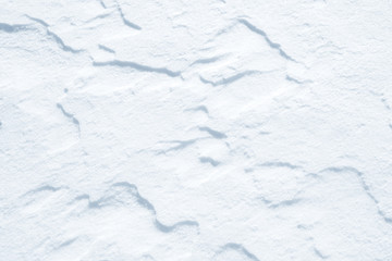 Fresh snow background texture. Winter background with snowflakes and snow mounds. Snow lumps.