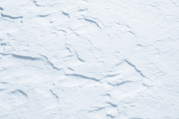 Fresh snow background texture. Winter background with snowflakes and snow mounds. Snow lumps.