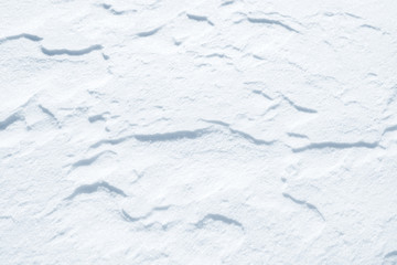 Fresh snow background texture. Winter background with snowflakes and snow mounds. Snow lumps.