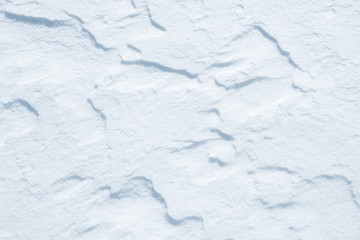 Obraz premium Fresh snow background texture. Winter background with snowflakes and snow mounds. Snow lumps.