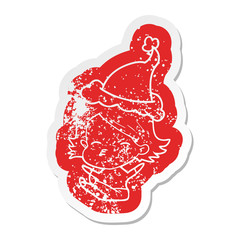 cartoon distressed sticker of a woman sitting wearing santa hat