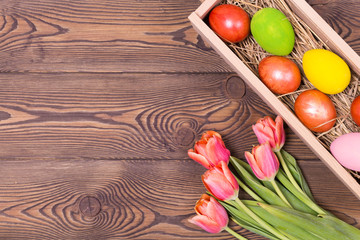 Happy Easter. Congratulatory easter background. Easter eggs and flowers