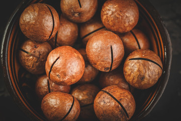 Macadamia nuts on wooden table
