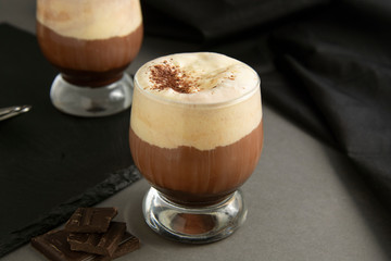 Coffee affogato with vanilla ice cream and espresso. Glass with coffee drink and icecream. Copy space.