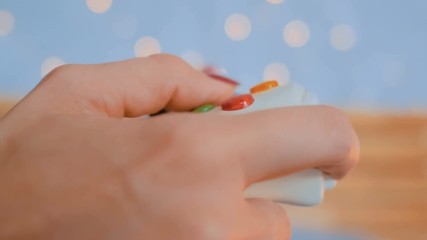 Christmas, gaming, holiday, celebration and technology concept - woman holding gamepad and playing video games at home - Powered by Adobe
