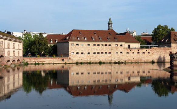 old dam "Barrage Vauban" and  old building in Strasbourg - France