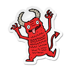 sticker of a cartoon demon
