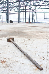 Sledgehammer made of metal pieces on concrete, closeup