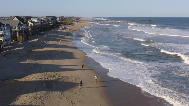 072 Aerial view of town, ocean and beach. 4k