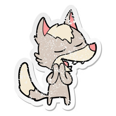 distressed sticker of a cartoon wolf laughing
