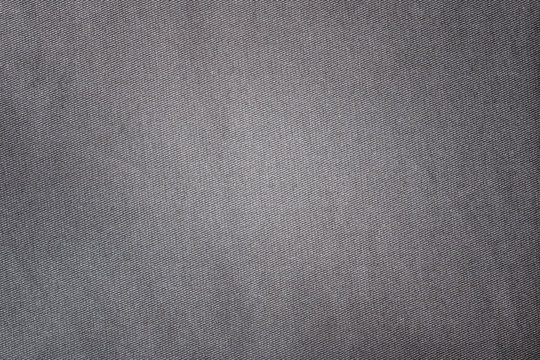 Gray fabric texture. Textile background with vignette