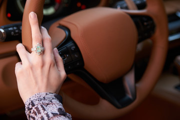 Woman driving car, Hand hold steering wheel, close-up