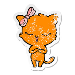 distressed sticker of a cartoon cat with bow on head