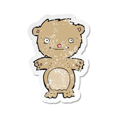 retro distressed sticker of a cartoon happy little teddy bear