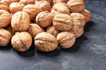 Walnuts on black table, Selective focus.