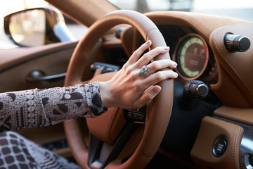 Woman driving car, Hand hold steering wheel, close-up