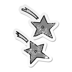 Obraz premium distressed sticker cartoon doodle of ninja throwing stars