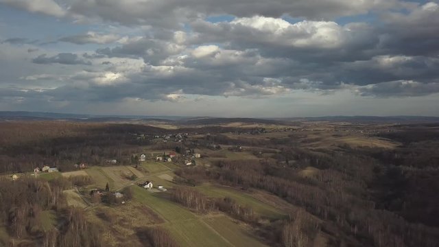 Panorama of the village near the city of Jaslo in Poland with a bird's-eye view. Stormy sky with clouds. Aerial photography of landscapes and settlements. Urbanization of the country. The living envir