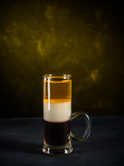 B-52 cocktail shot on dark gray concrete background