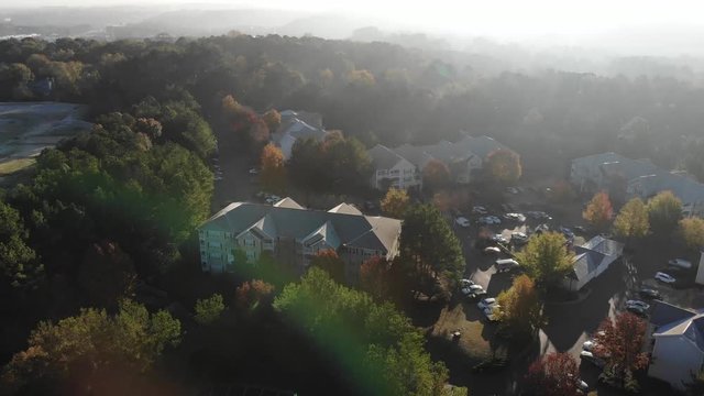 Aerial Tilt Reveal. Maintenance Crew Truck Early Morning Apartment Complex In Woodstock GA.