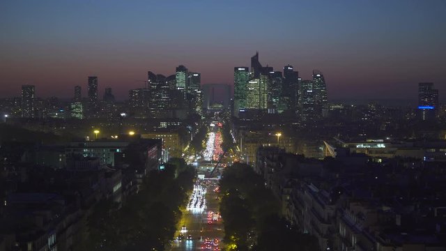 Paris cityscape. Aerial of traffic on Avenue de la Grande at night. Background with financial buildings - September 2018: Paris, France