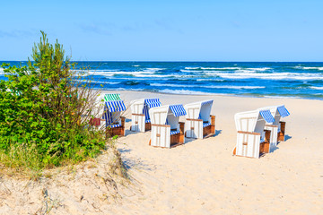 Beach chairs on sea coast near Baabe village on Rugen island, Baltic Sea, Germany